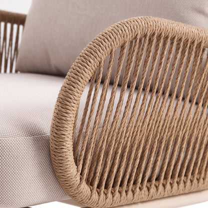 Close-up of a woven armrest and upholstered cushion details on a white background