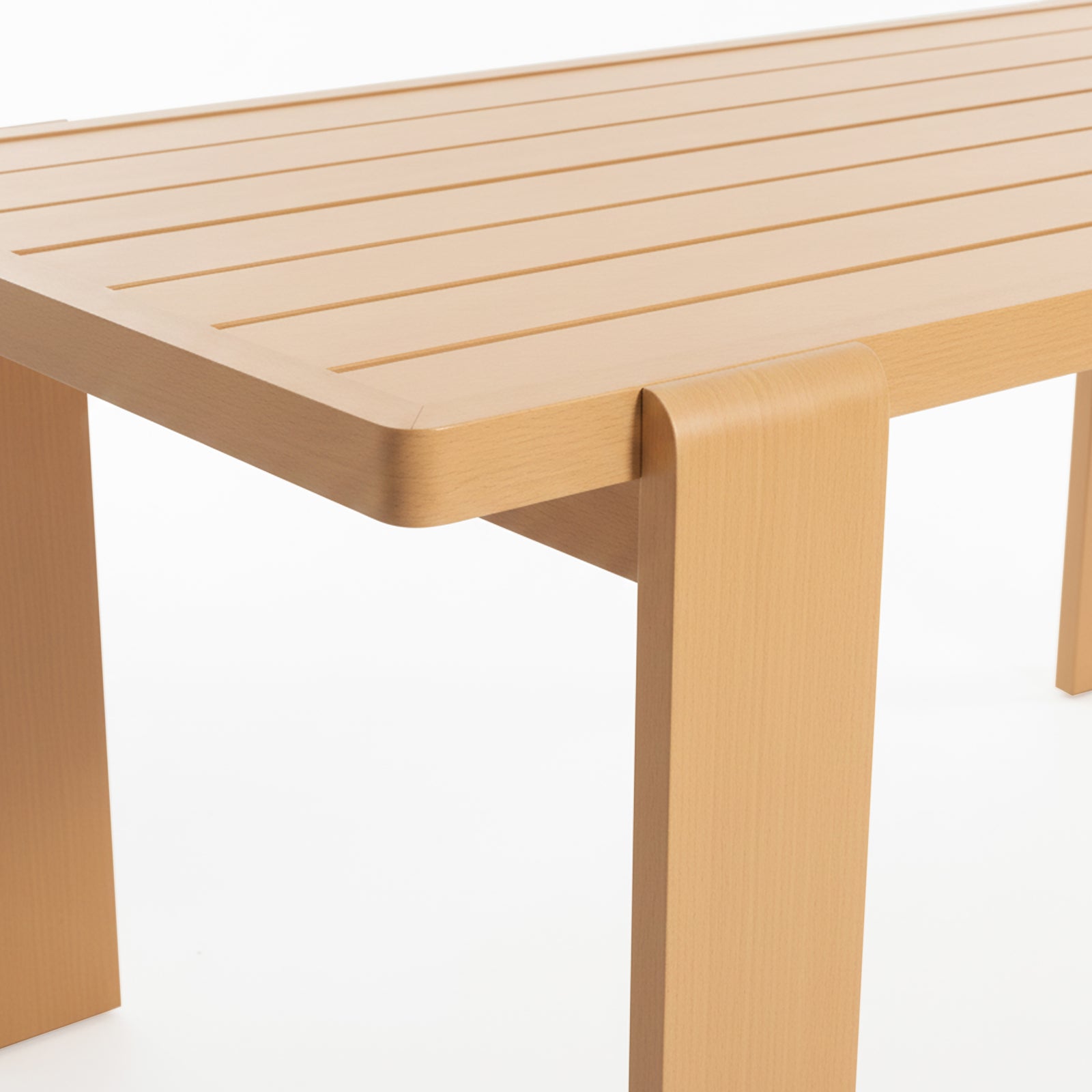 Close-up of the Positano 6 Seater Aluminium Outdoor Dining Set in White, showcasing a light-wood table with shallow grooves and rounded corners, featuring broad legs that wrap over the tabletop edge.