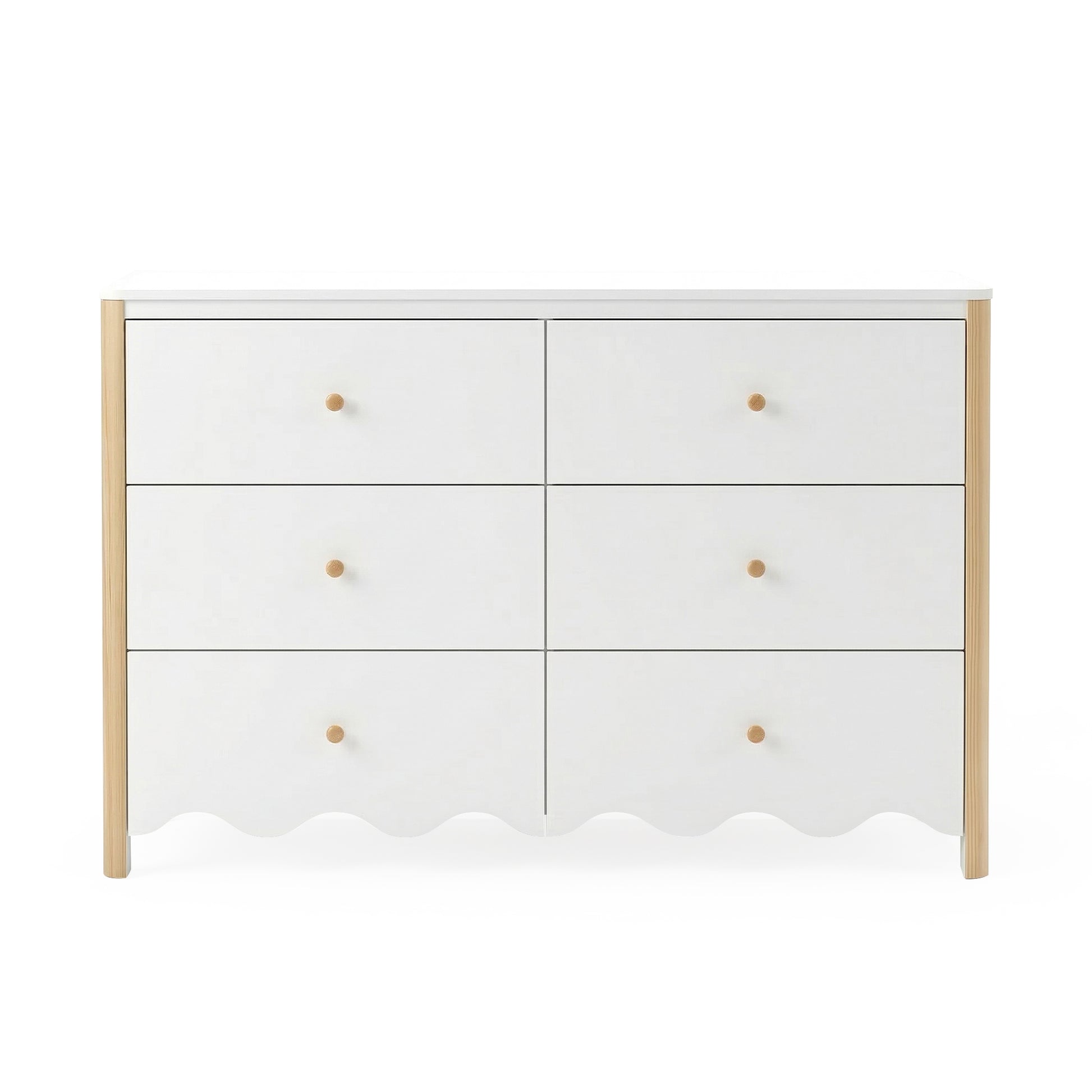 Front view of white six-drawer dresser with scalloped edge and wood accents on white background