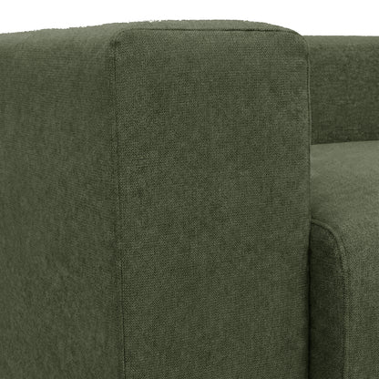 Close-up of green sofa armrest and backrest on white background