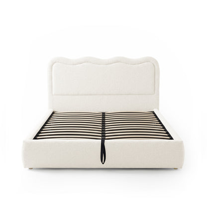 Upholstered bed frame without mattress on white background
