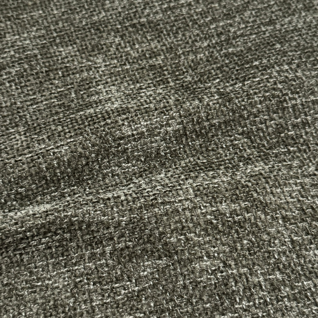 Close-up of moss green woven fabric texture