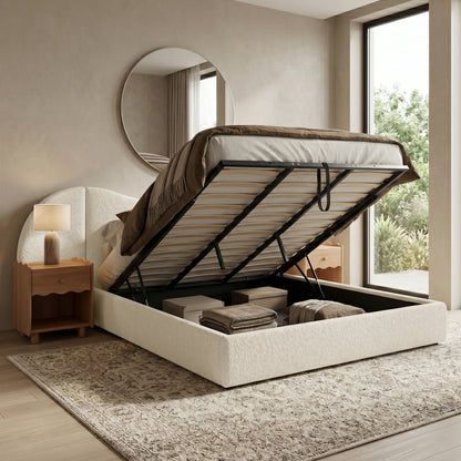 Upholstered storage bed lifted open in a modern bedroom setting