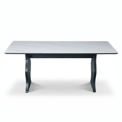 Full rectangular table with light marble-look top and dark sculptural legs on a white background