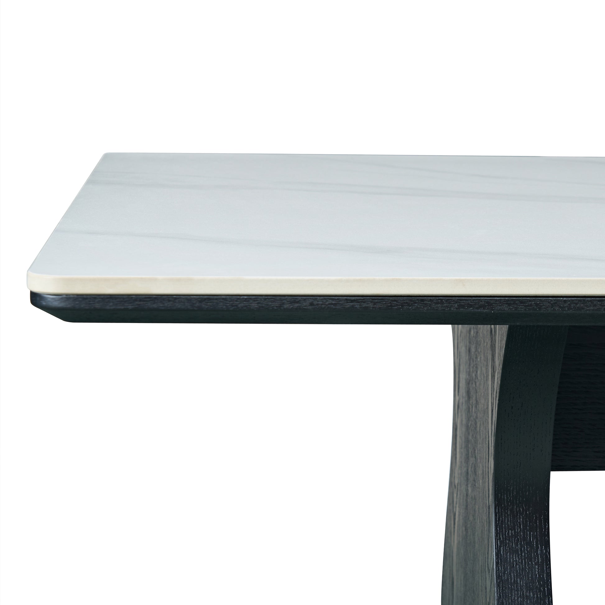 Close-up of table corner with light top and dark leg on white background
