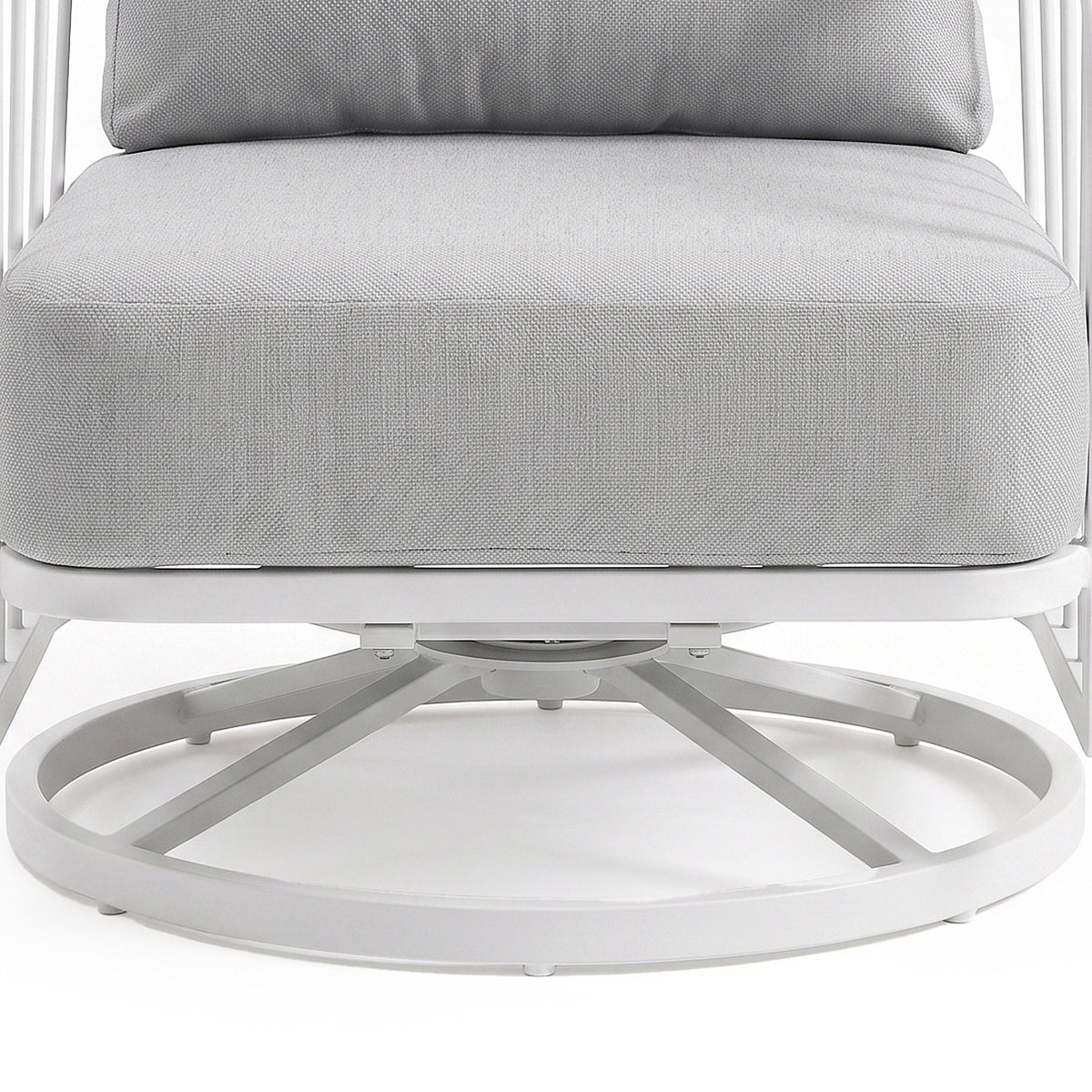 Close-up of the lower half of a cushioned chair with metal base on a white background