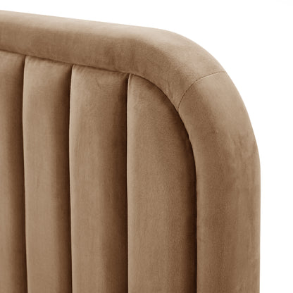 Close-up detail of tan upholstered headboard fabric texture