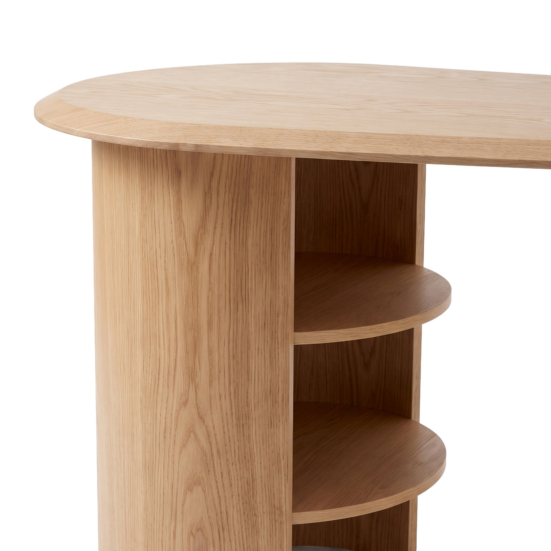Partial view of a light wood desk end with open shelves on a white background.