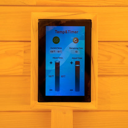 Digital sauna control panel mounted on a wooden wall