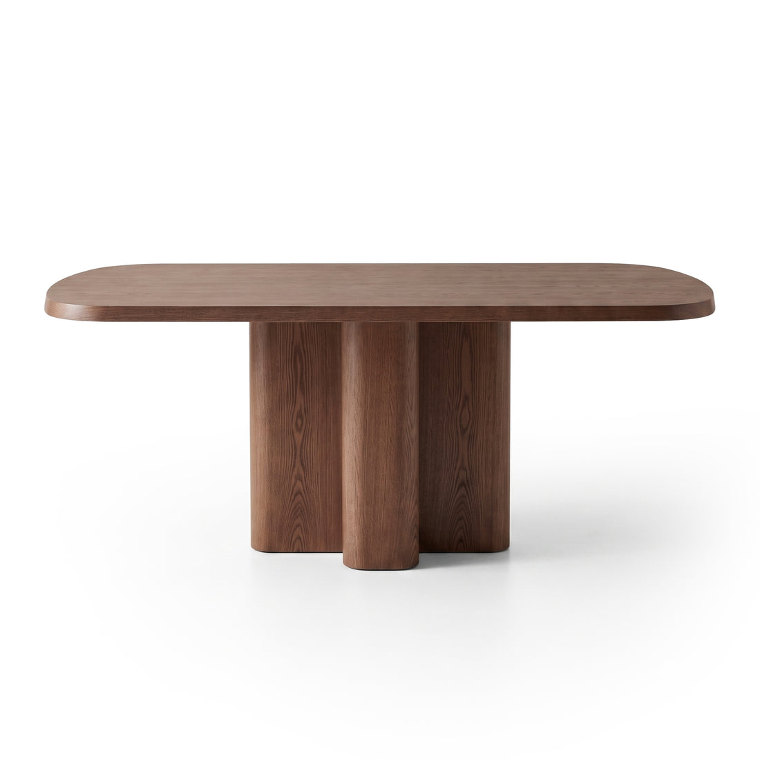 Modern rectangular wooden dining table with rounded edges and sculptural cylindrical base on white background.