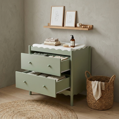 Sage green dresser or changing table styled in a modern room with accessories