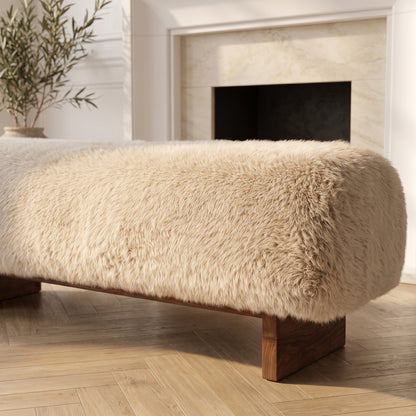 Partial view of a beige fur-covered bench in a room setting