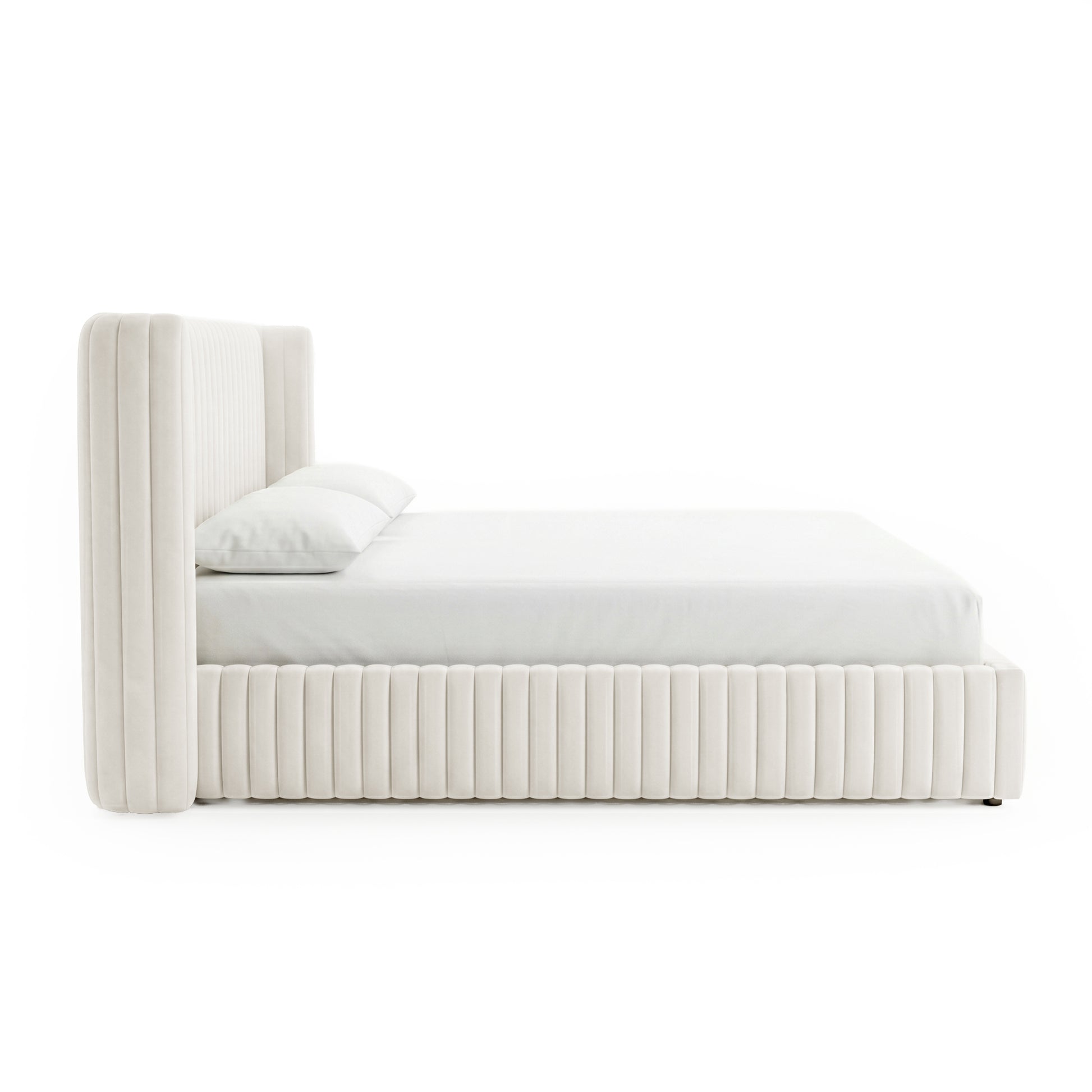 Side profile of upholstered bed on white background
