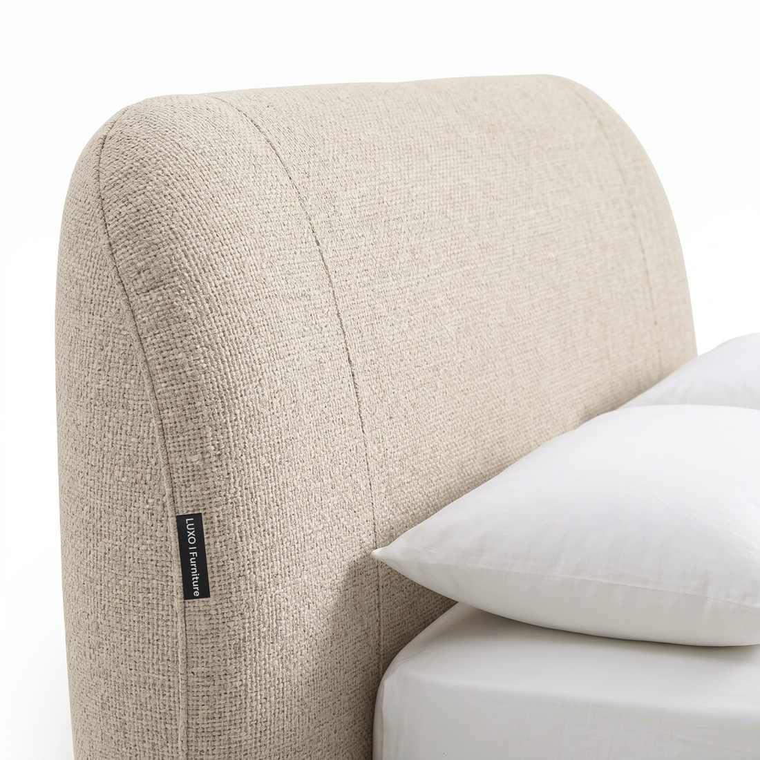 Close-up of an upholstered bed headboard on a white background