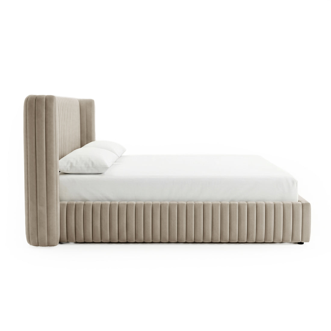 Side profile of beige upholstered bed with vertical channel tufting