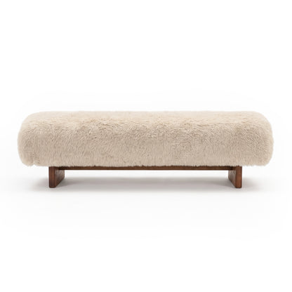 Beige plush upholstered bench with wooden legs on a white background