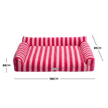 Pink striped pet bed on white background with dimension lines marking 25 cm, 81 cm, and 110 cm