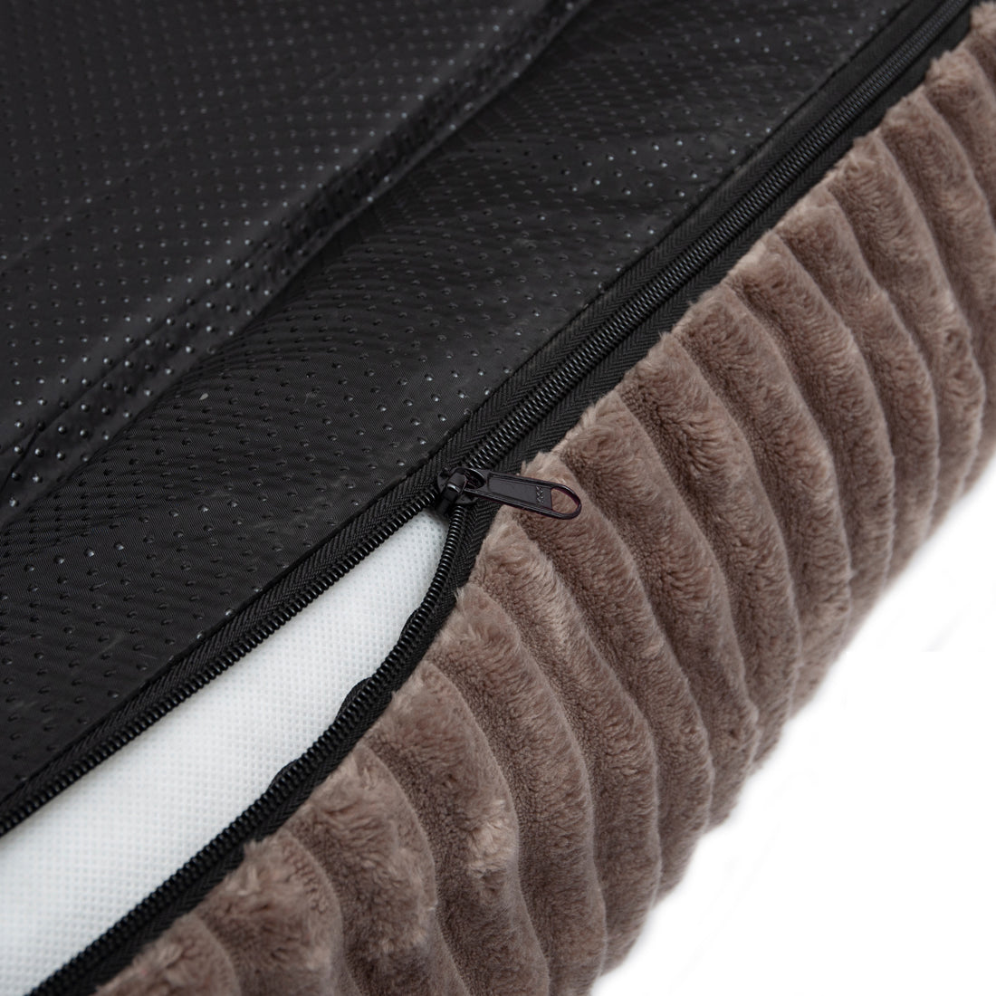Close-up zipper and fabric textures on pet bed cover