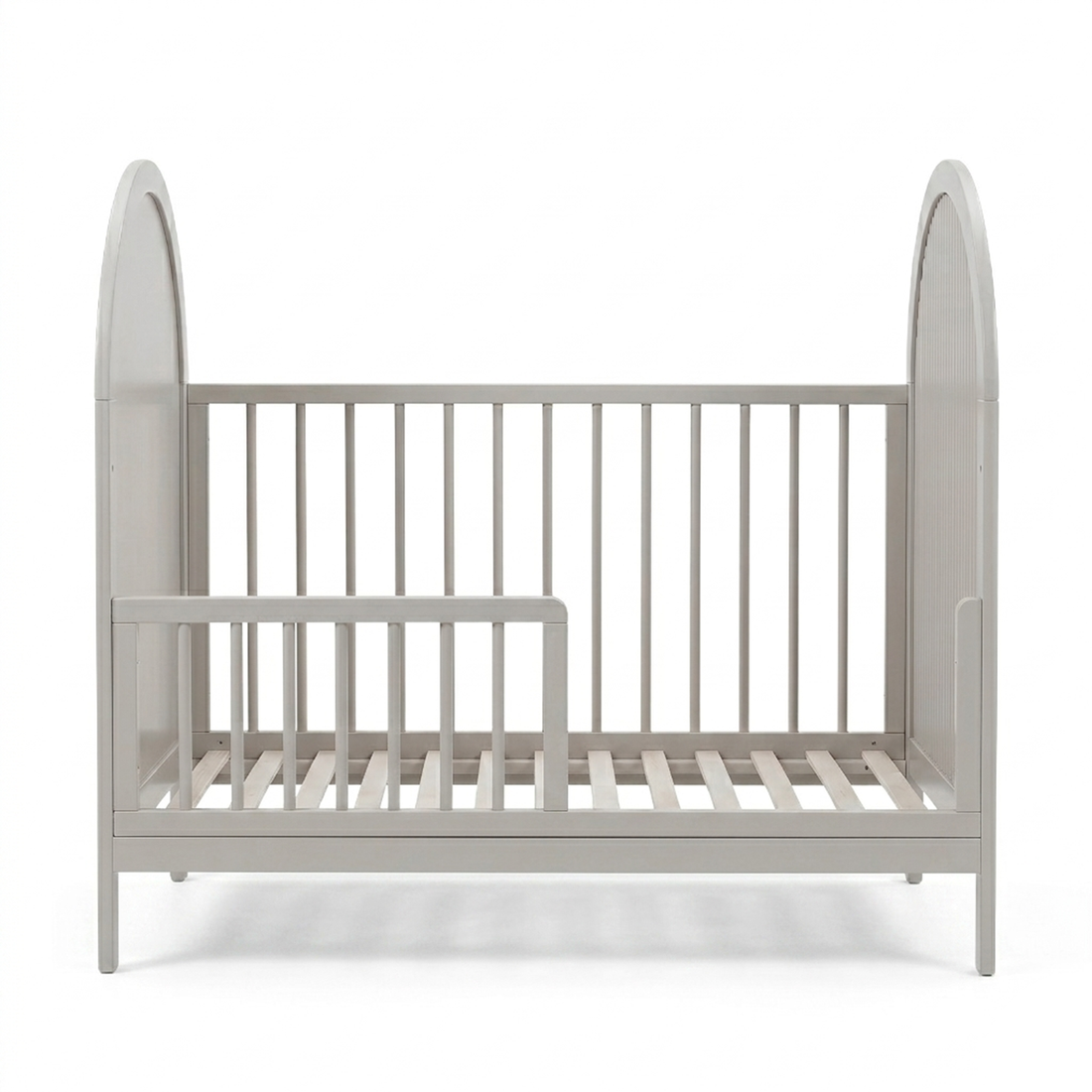 Light gray crib with arched ends on white background