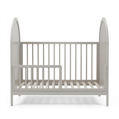 Light gray crib with arched ends on white background