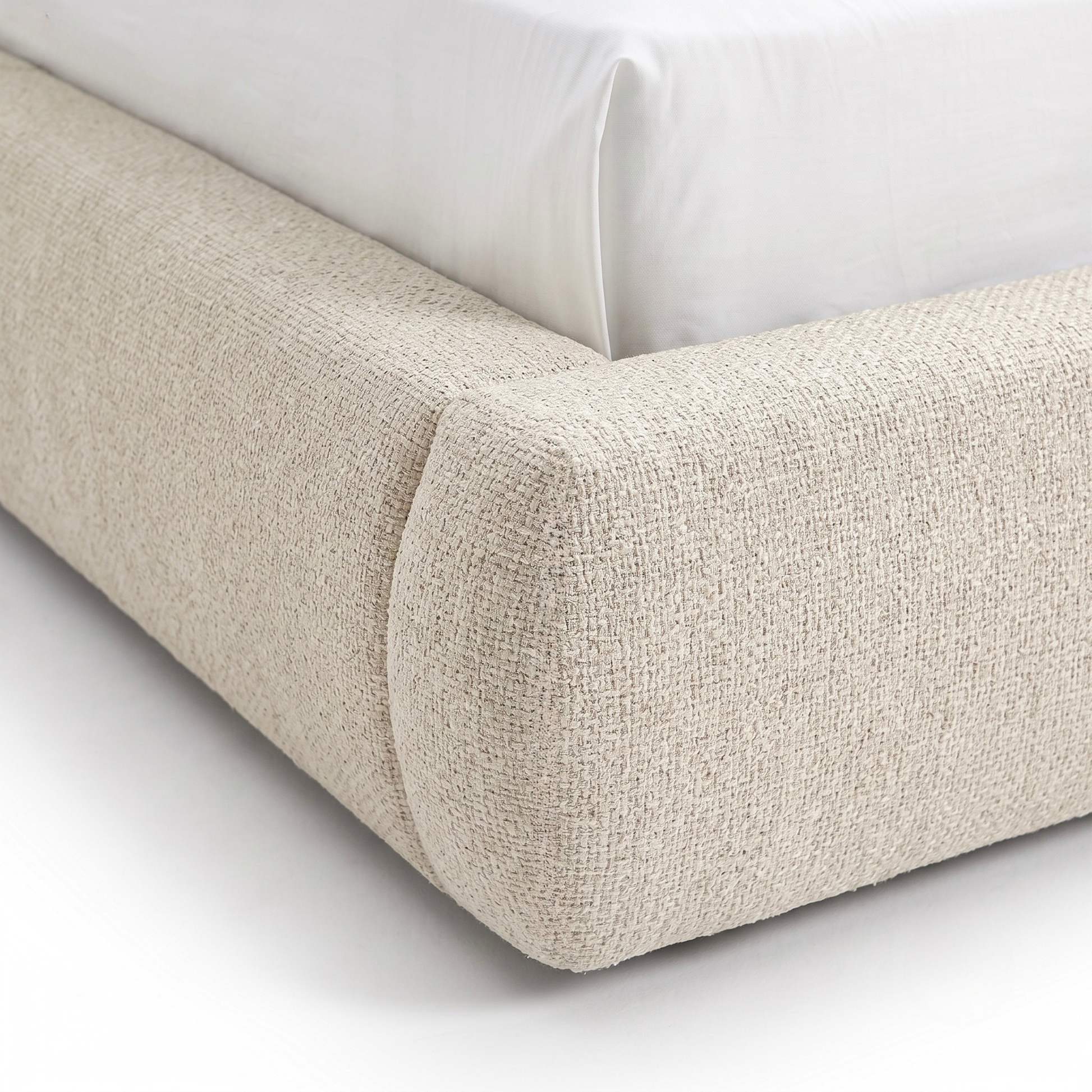 Close-up of upholstered bed corner and fabric texture