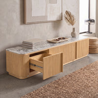 Modern wooden sideboard with marble top styled in a contemporary living room