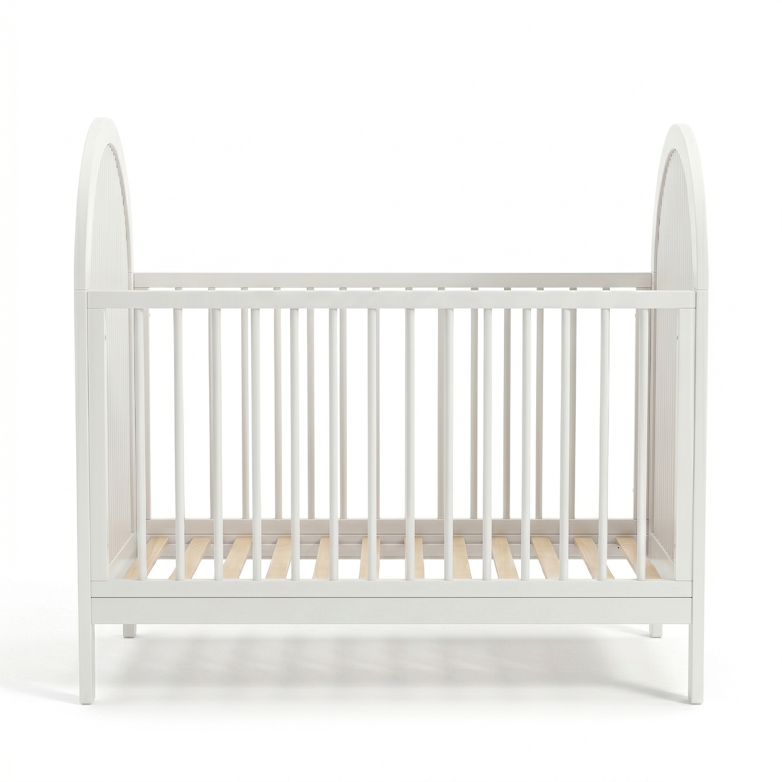 Full view of a white baby crib on a white background