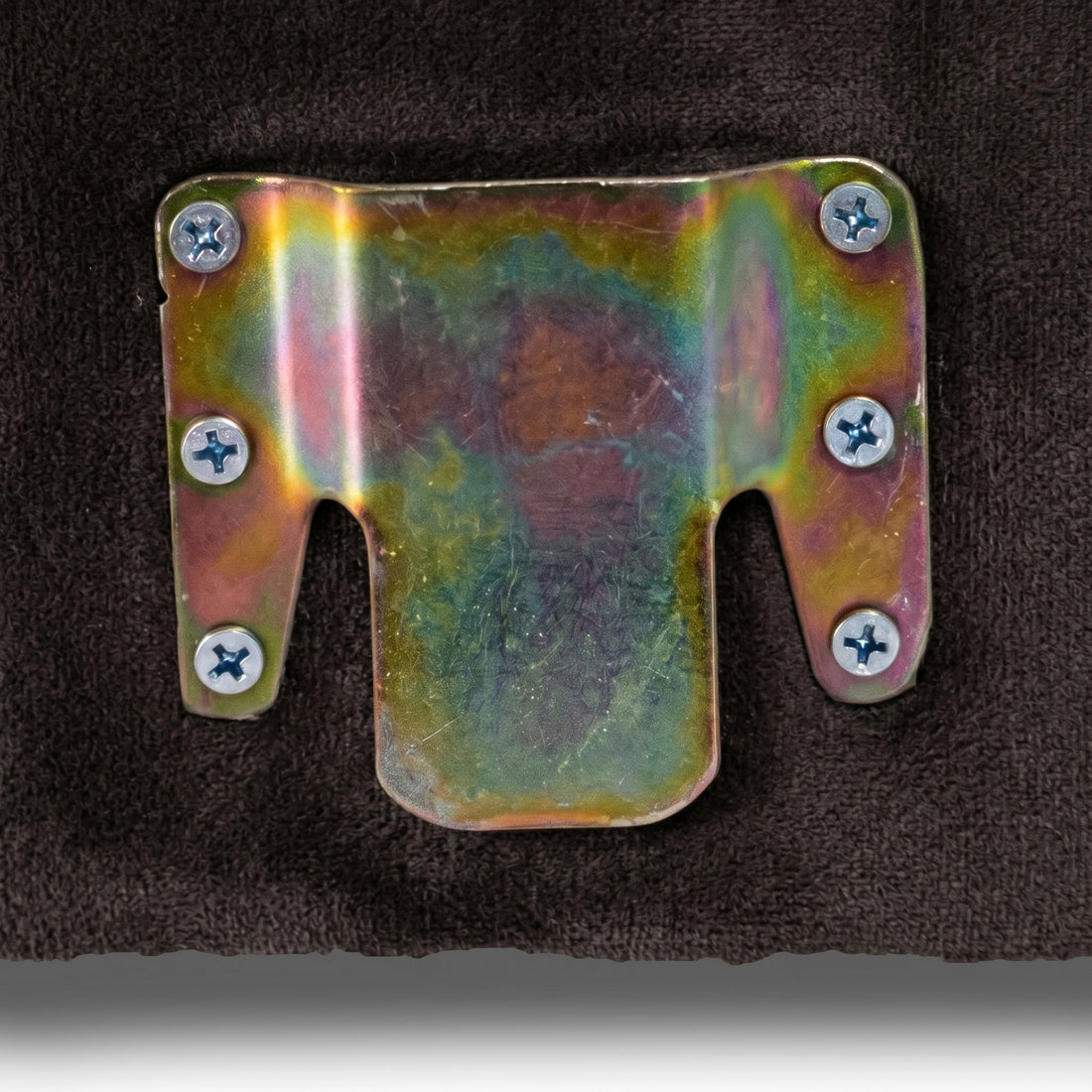 Macro view of metal furniture bracket fixed to fabric surface