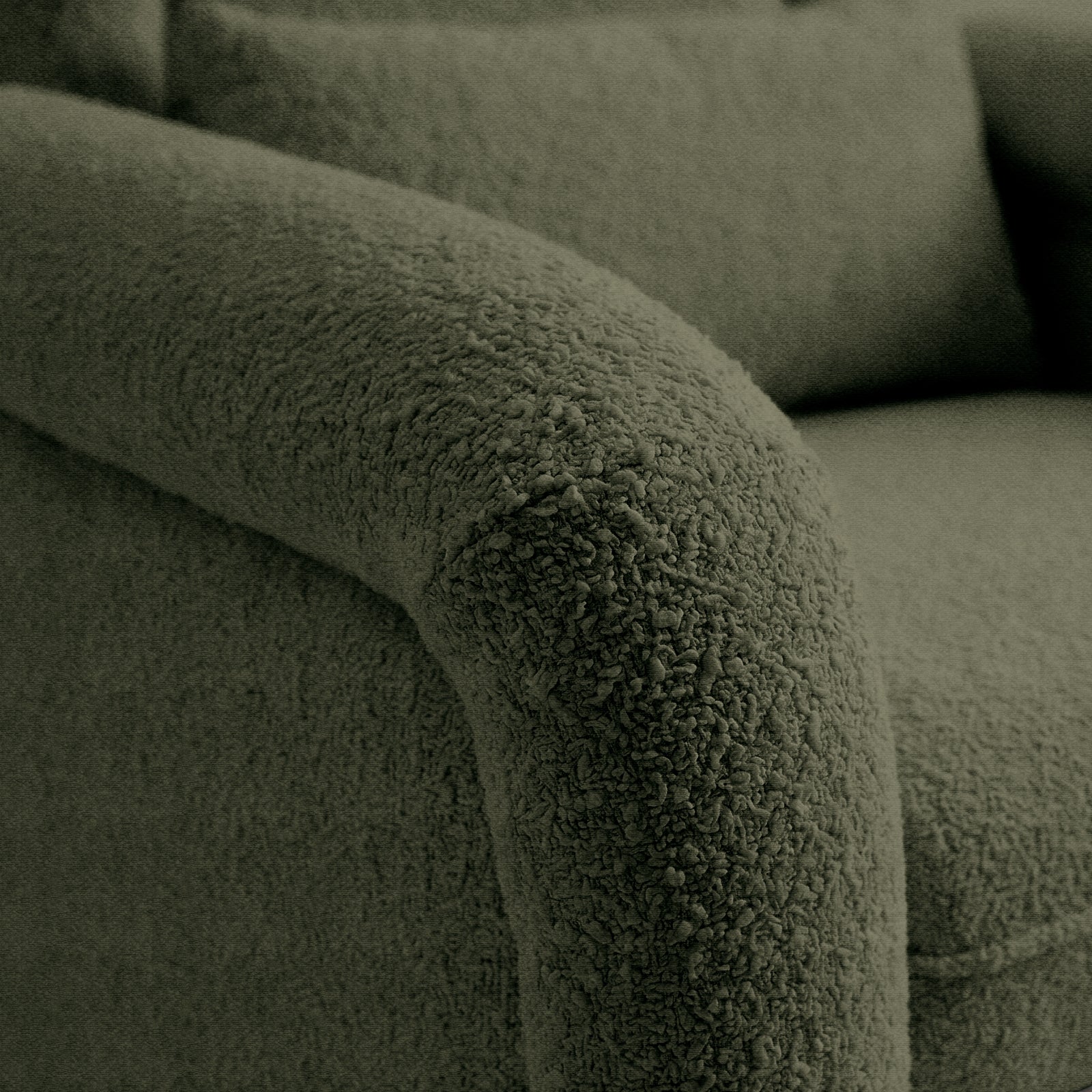 Detail of boucle-like upholstery texture on armrest