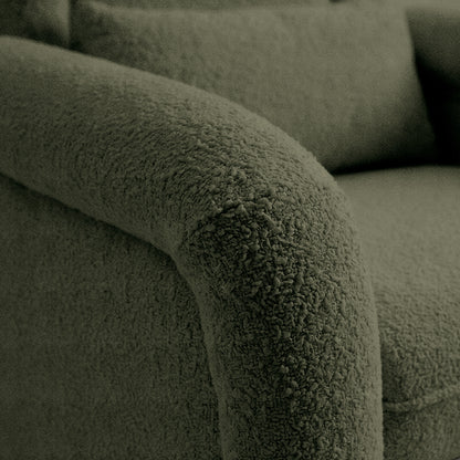 Detail of boucle-like upholstery texture on armrest