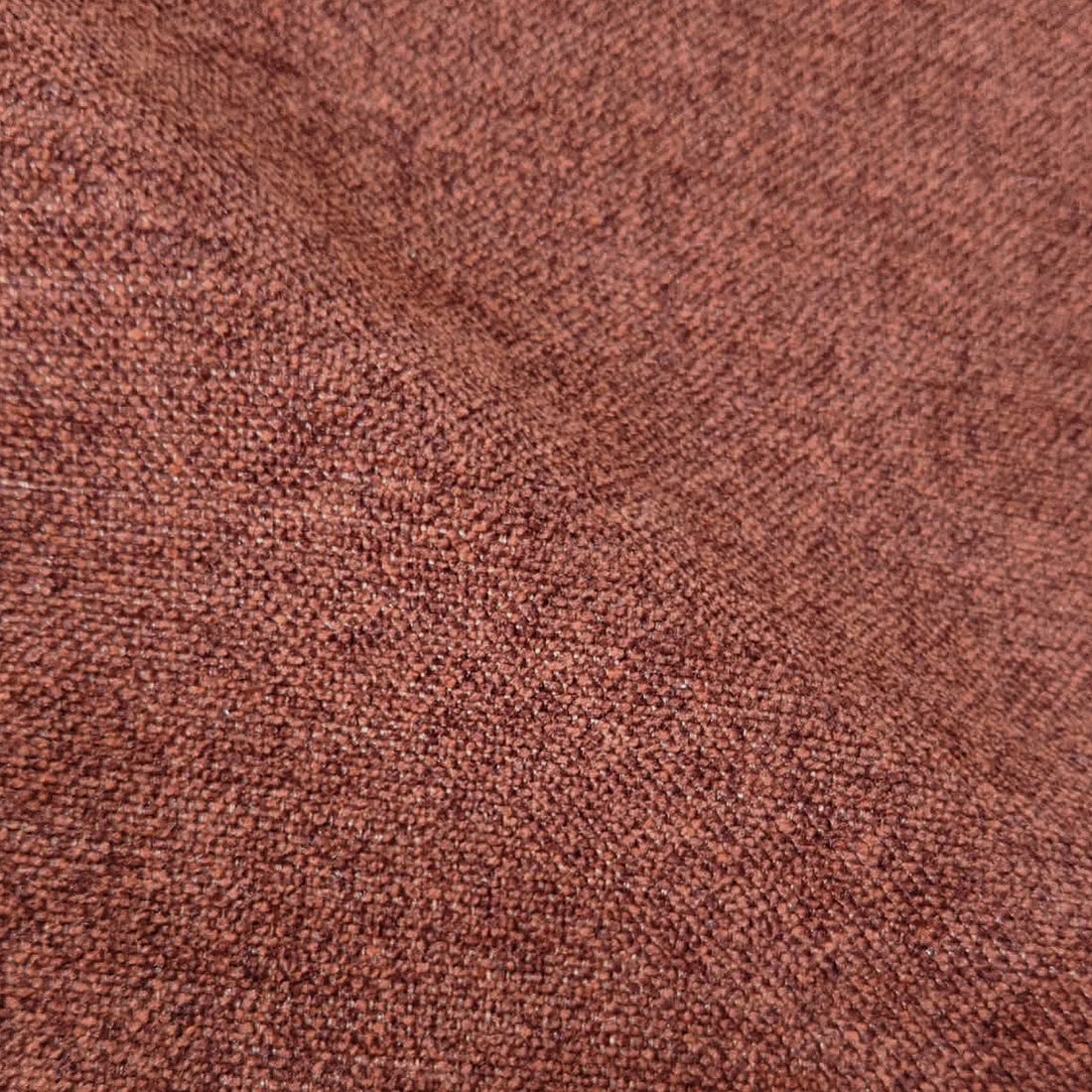 Macro view of terracotta woven upholstery fabric