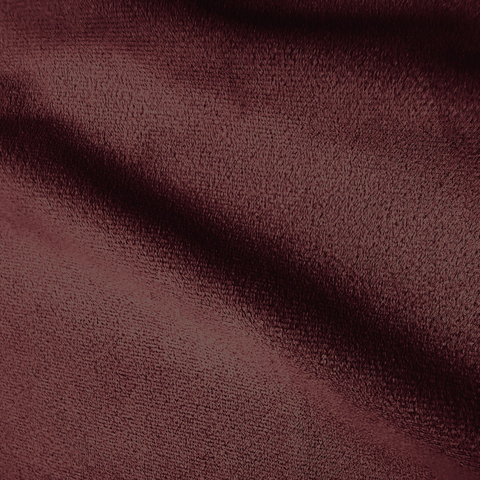 Close-up of burgundy sofa fabric texture.