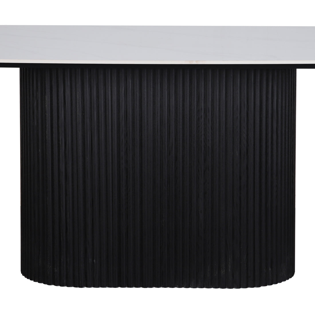 Aeris 180cm Marble Look Dining Table With Wood Base in Black features a white, marble-style top on a vertically fluted, cylindrical black base, embodying modern elegance and practicality.
