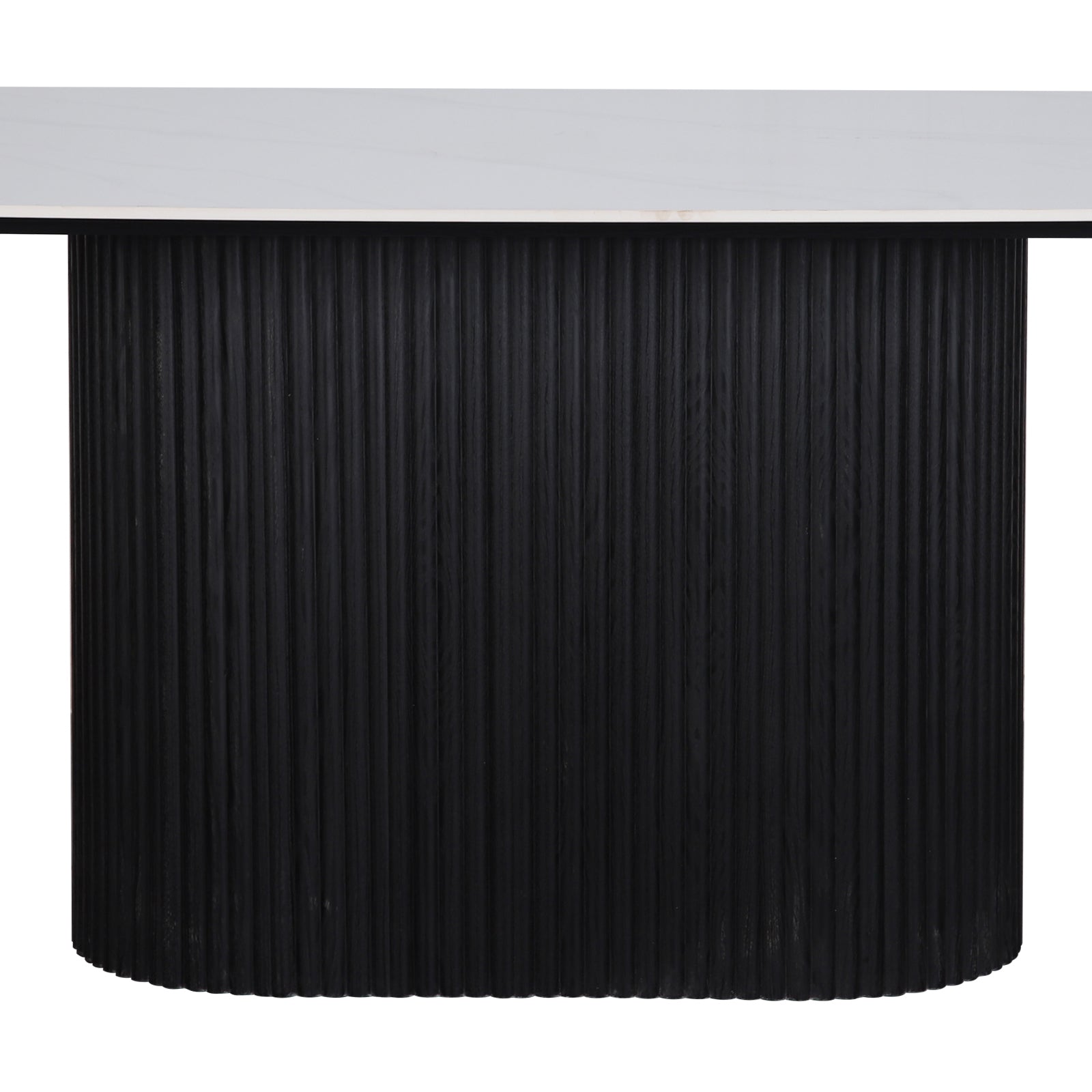 Aeris 180cm Marble Look Dining Table With Wood Base in Black features a white, marble-style top on a vertically fluted, cylindrical black base, embodying modern elegance and practicality.
