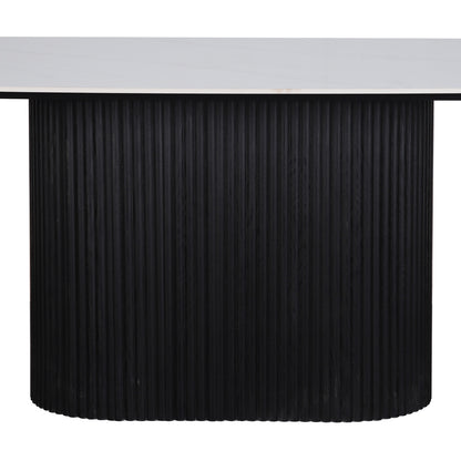 Aeris 180cm Marble Look Dining Table With Wood Base in Black features a white, marble-style top on a vertically fluted, cylindrical black base, embodying modern elegance and practicality.