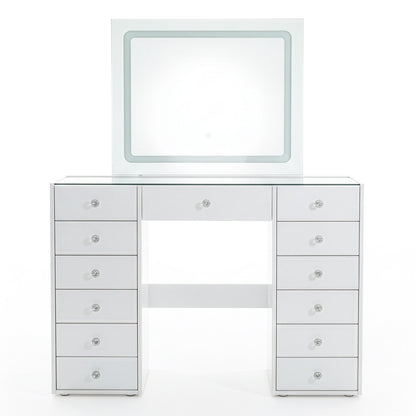 White vanity table with attached square mirror and crystal drawer knobs on white background