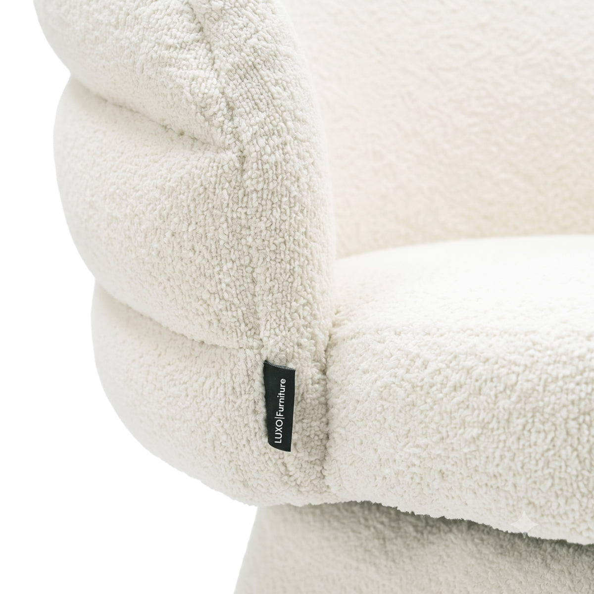 Close-up of textured off-white chair upholstery on a white background.