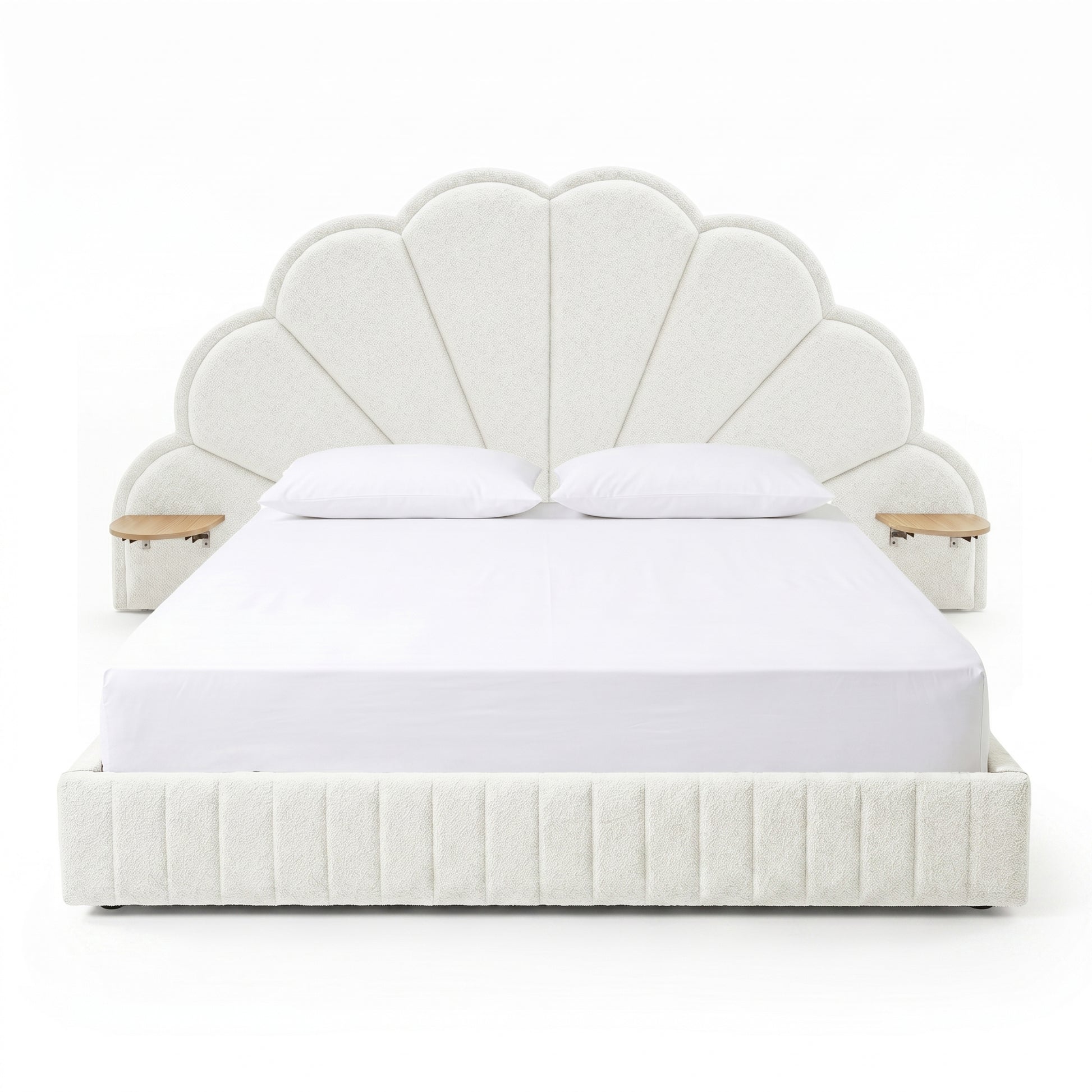 Modern scallop-shaped upholstered bed with integrated side tables on white background