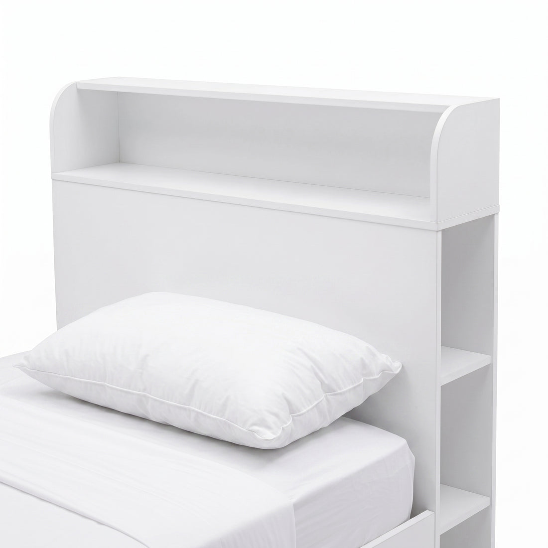 Close-up of the headboard and upper portion of a white bed with built-in shelving.