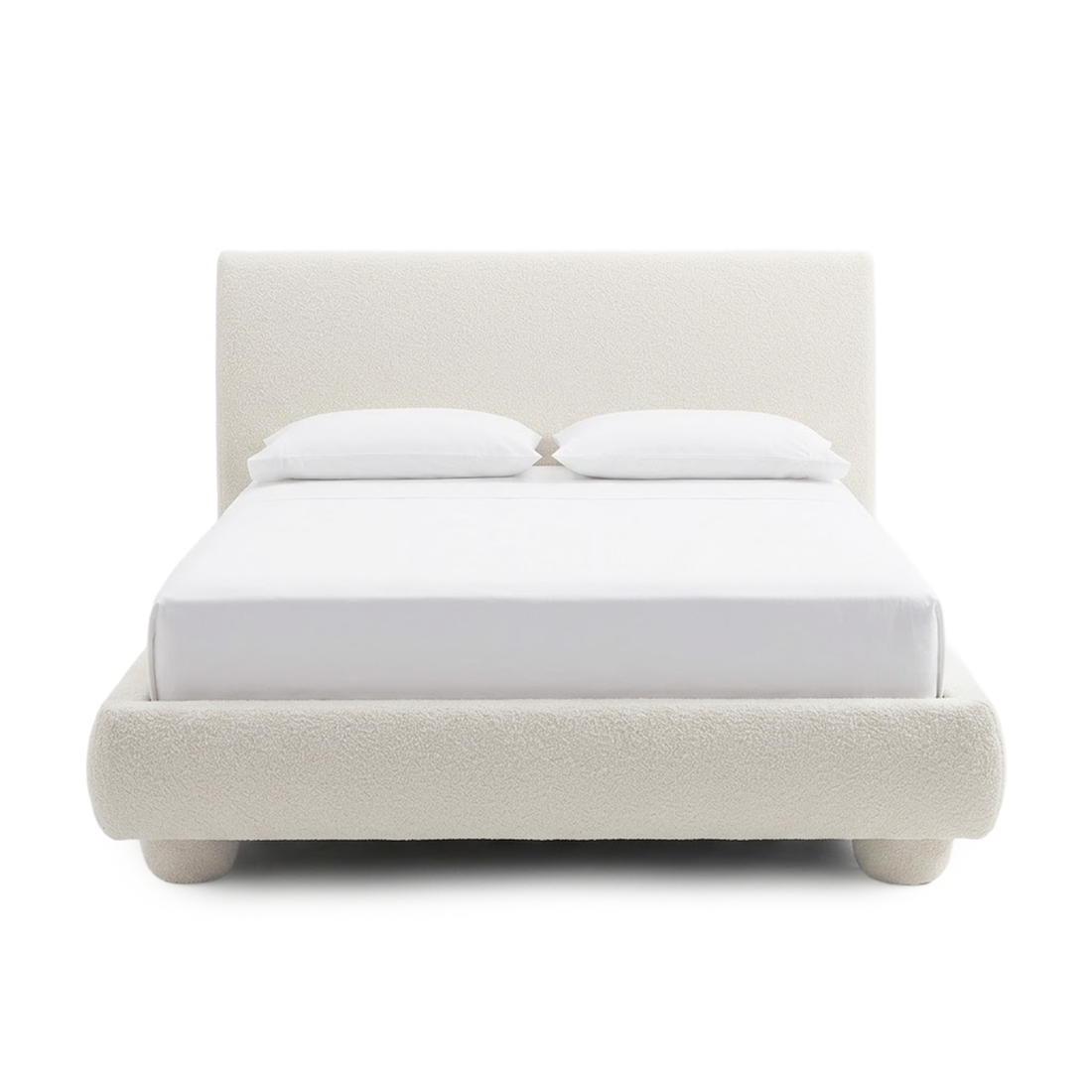 Full upholstered bed with pillows on a white background