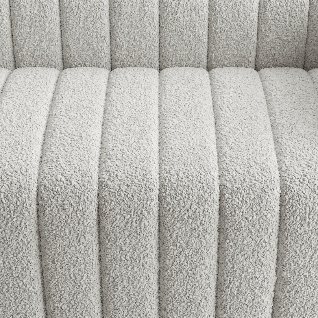Close-up of light textured upholstered fabric with channel stitching