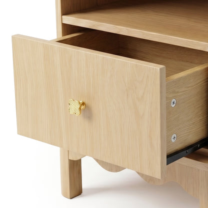 Close-up of drawer front and open shelf on wooden furniture