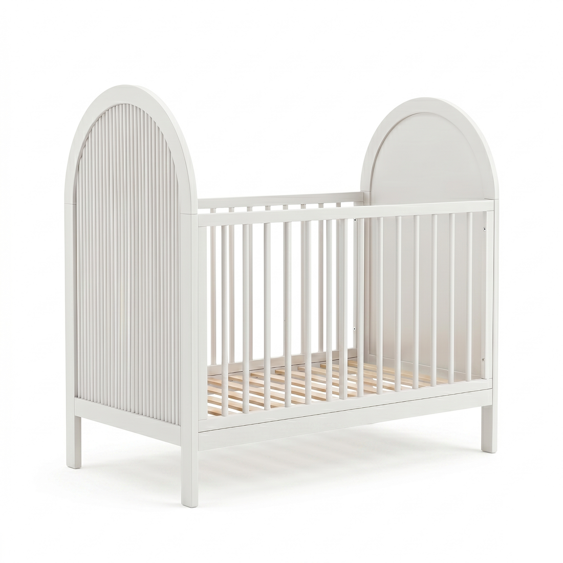 White baby crib with arched headboard and slatted sides on plain white background