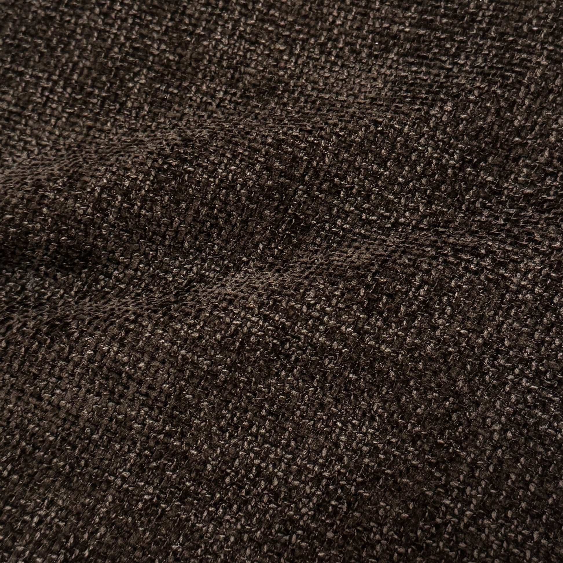 Close-up of cocoa brown woven upholstery fabric texture.