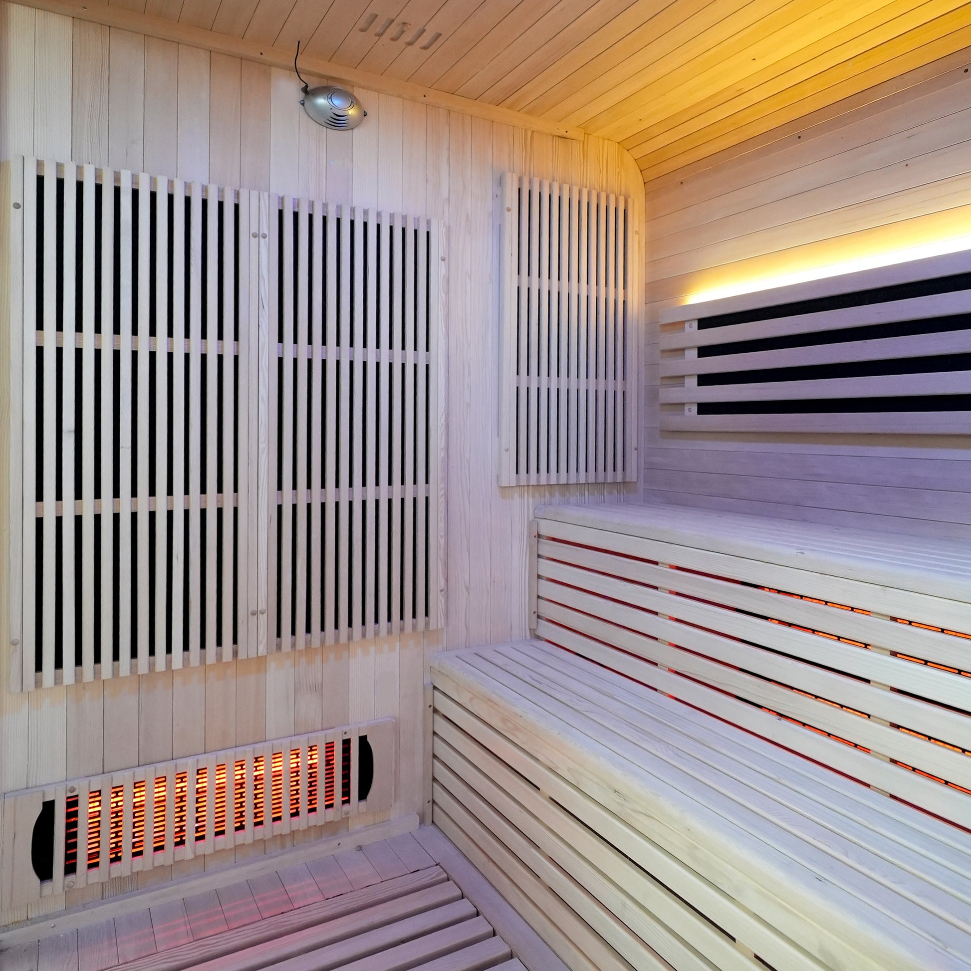 Close-up of infrared sauna interior with benches and heating panels