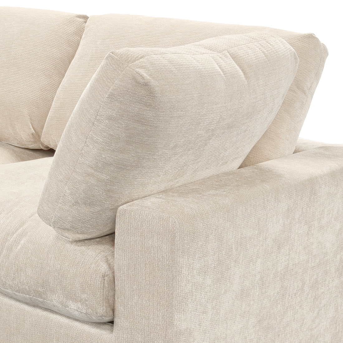 Close-up of beige sectional sofa arm and cushions on white background