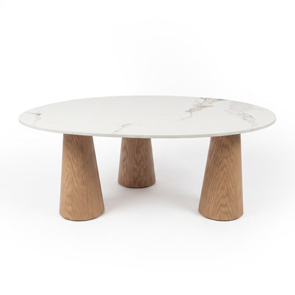 Modern round coffee table with marble-effect top and three angled wooden legs on a white background
