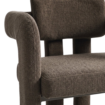 Close-up of the upper portion of a dark brown upholstered chair on a white background