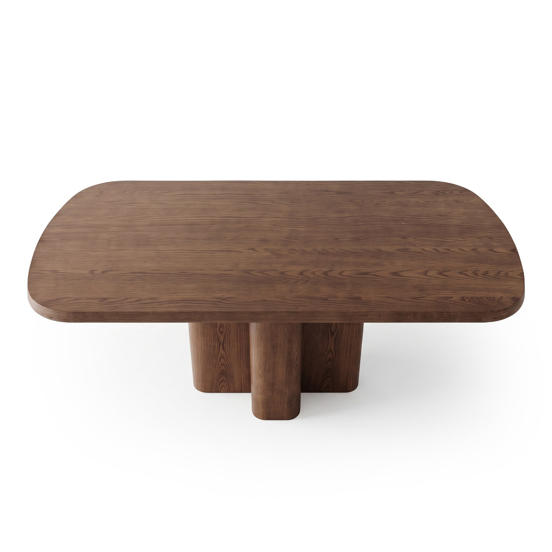 Dark wooden table with rounded corners and thick cylindrical legs on white background.