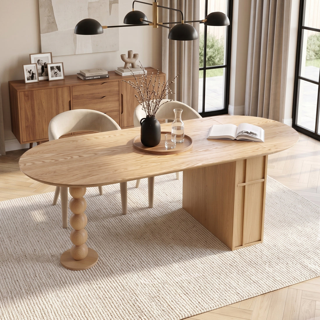 Modern oval wooden table styled in a contemporary room with decor and daylight